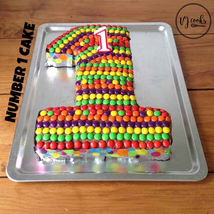 A number one birthday cake decorated with Smartie lollies.