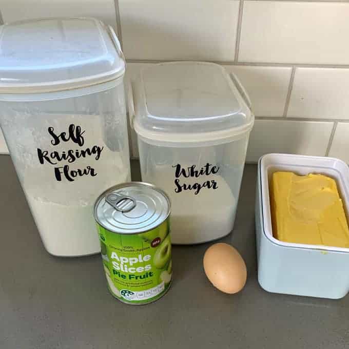 Ingredients for Easy Apple Slice on a grey bench.