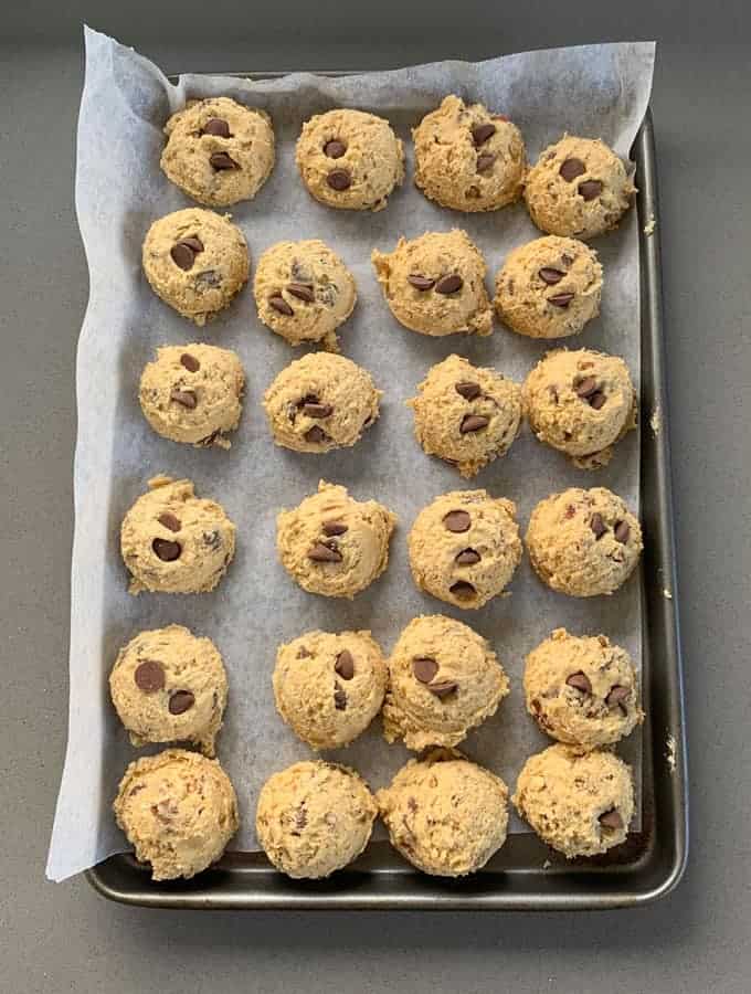 cookie dough rolled onto a tray 