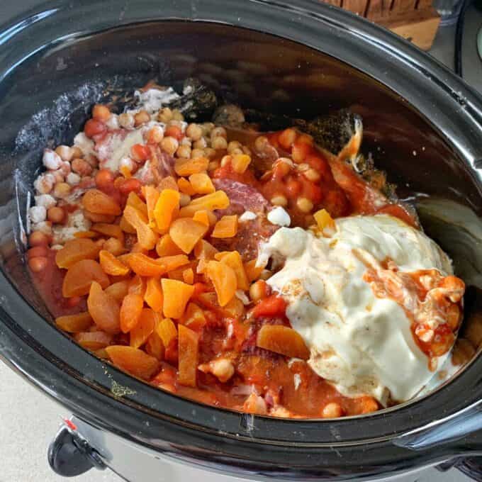 Slow Cooker Moroccan Lamb with Apricots A slow cooker Moroccan lamb dish filled with chickpeas, chopped dried apricots, tomato sauce, whole spices, and a large dollop of yogurt or cream.
