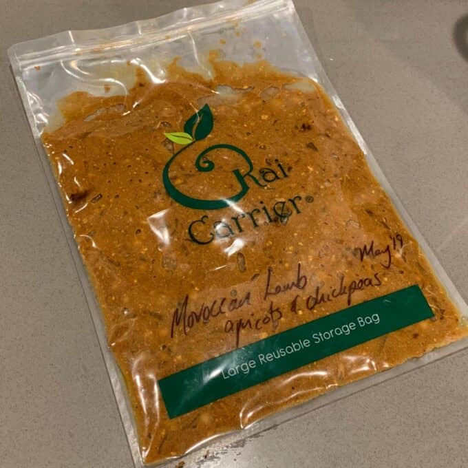 Slow Cooker Moroccan Lamb with Apricots A sealed reusable storage bag labeled Slow Cooker Moroccan Lamb apricots & chickpeas May 19 contains a brownish-orange mixture on a countertop.