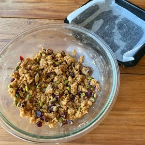 The ingredients for the base of Cranberry and pistachio slice in a glass bowl. 