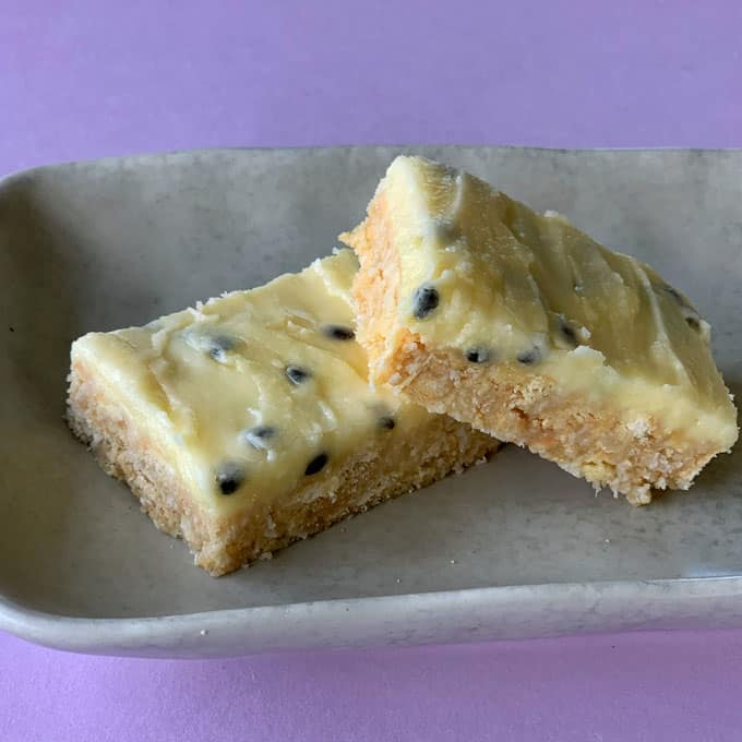 VJ cooks simple no-bake passionfruit slice on a purple background