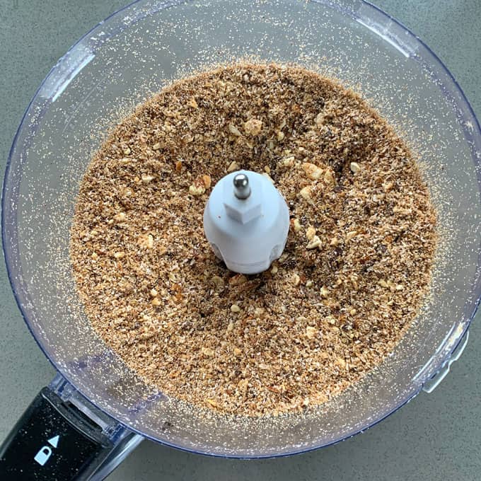 Chocolate, Date and Weetbix Bliss Balls A food processor bowl containing finely ground nuts or crumbs, viewed from above—perfect as the base for Chocolate Date Weetbix Bliss Balls.