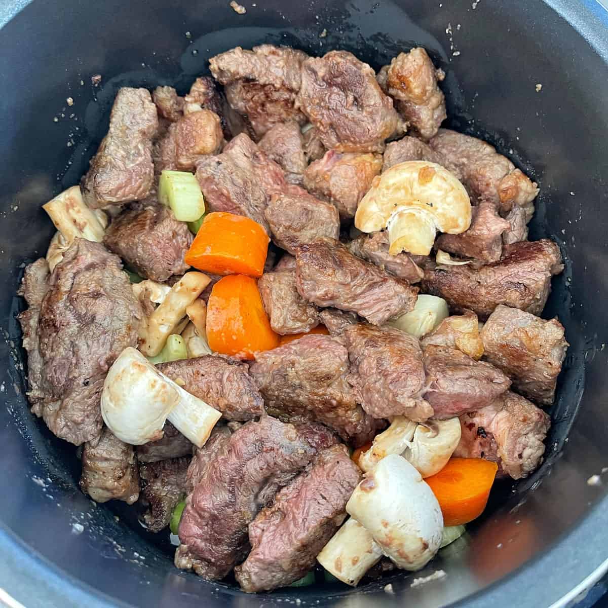 Beef stew ingredients in the slow cooker.
