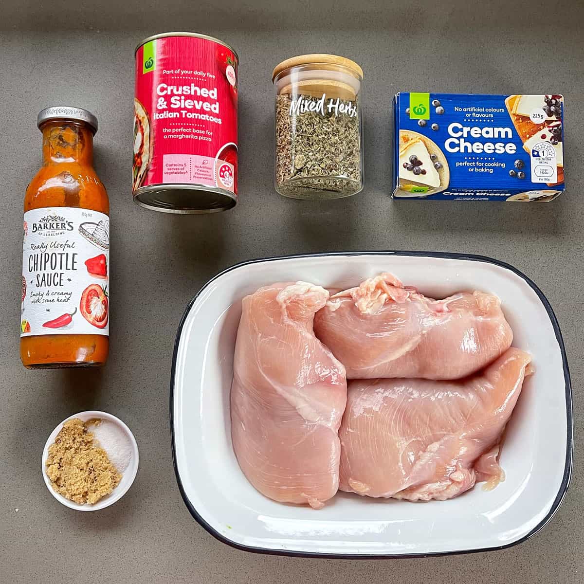 Ingredients for Slow Cooker Shredded Chicken on a grey bench.