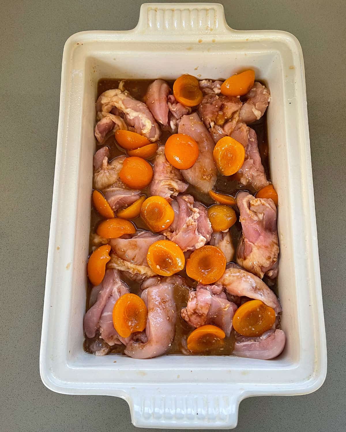 Apricot chicken tray bake before going into the oven