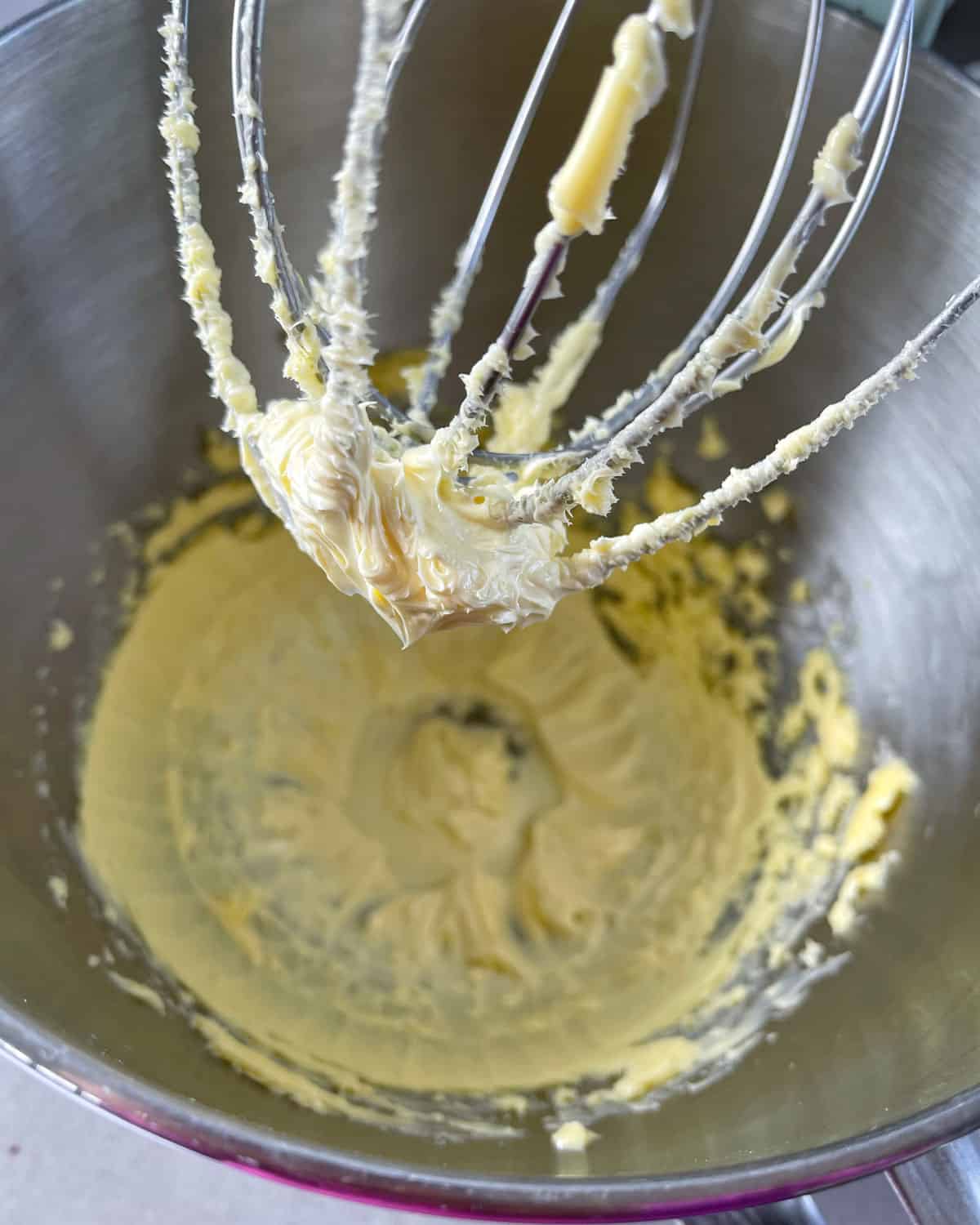 Butter being whipped in a stand mixer