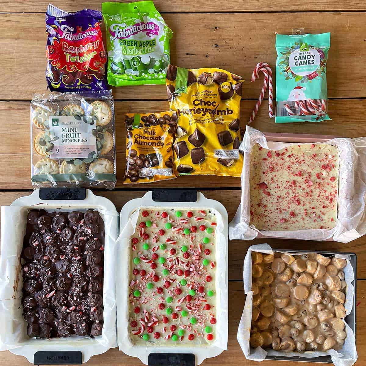 The components of a Christmas Treat Box sitting on a wooden bench.