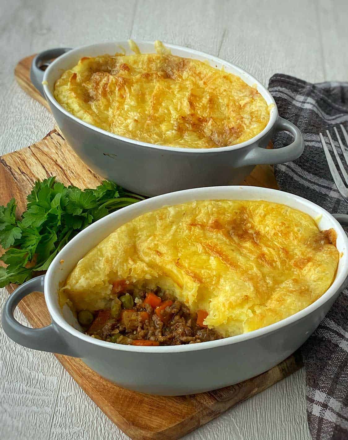 Two individual beef cottage pies.