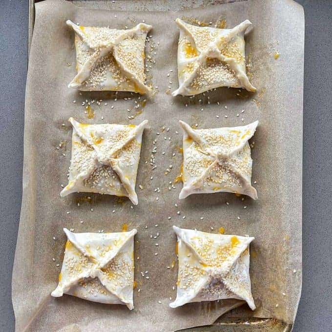 Moroccan Lamb Pies Raw Moroccan Lamb Pies on a lined tray before going in to the oven.