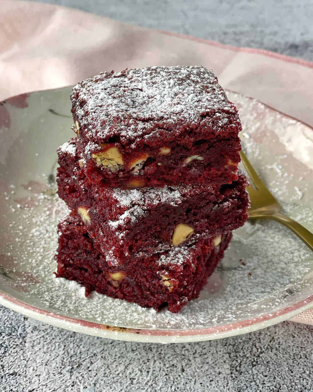A stack of Red Velvet Brownie on a white plate.