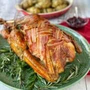 A Roast Turkey on a green platter.