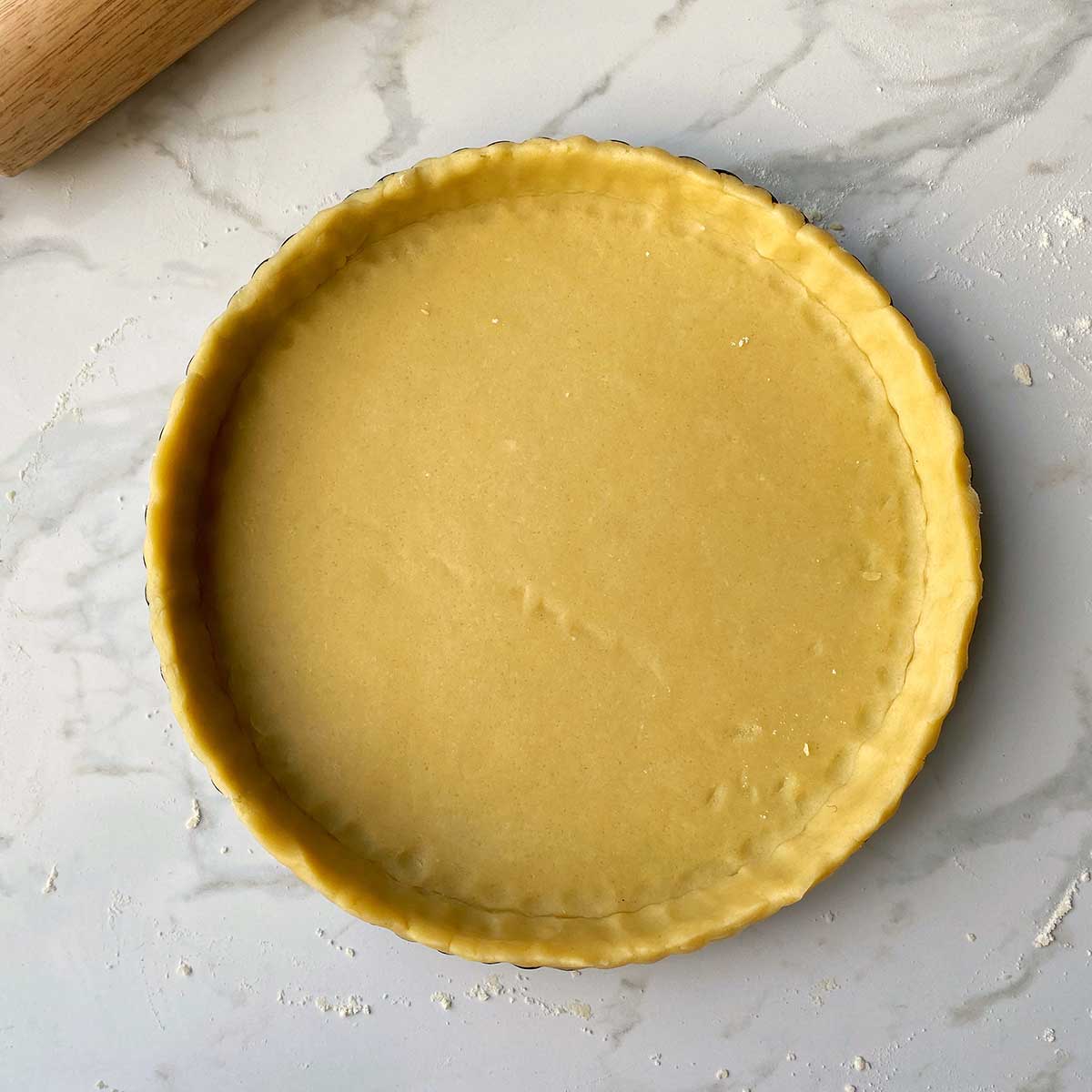 Sweet Short Pastry in the base of a pie dish.
