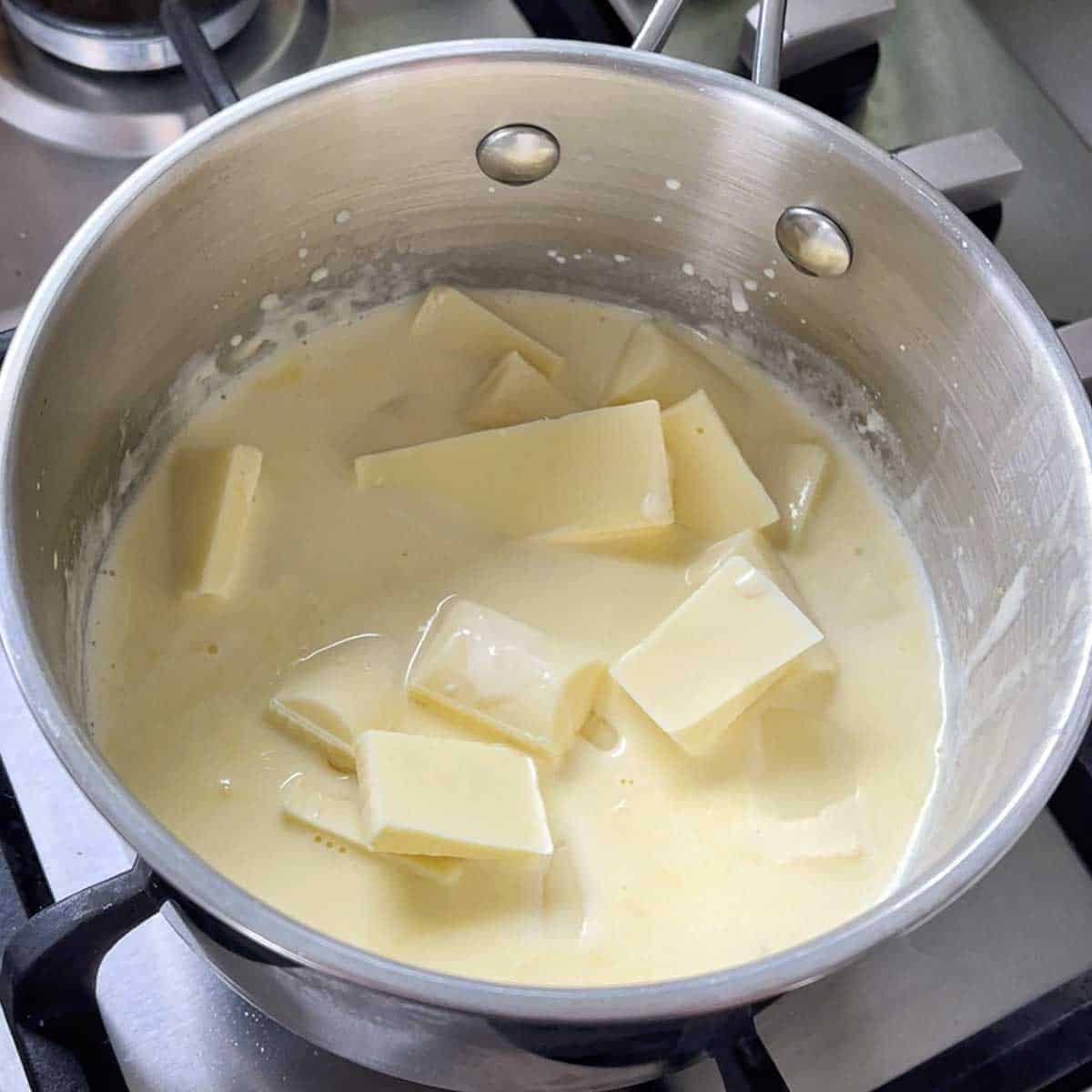 White chocolate melting in a saucepan.