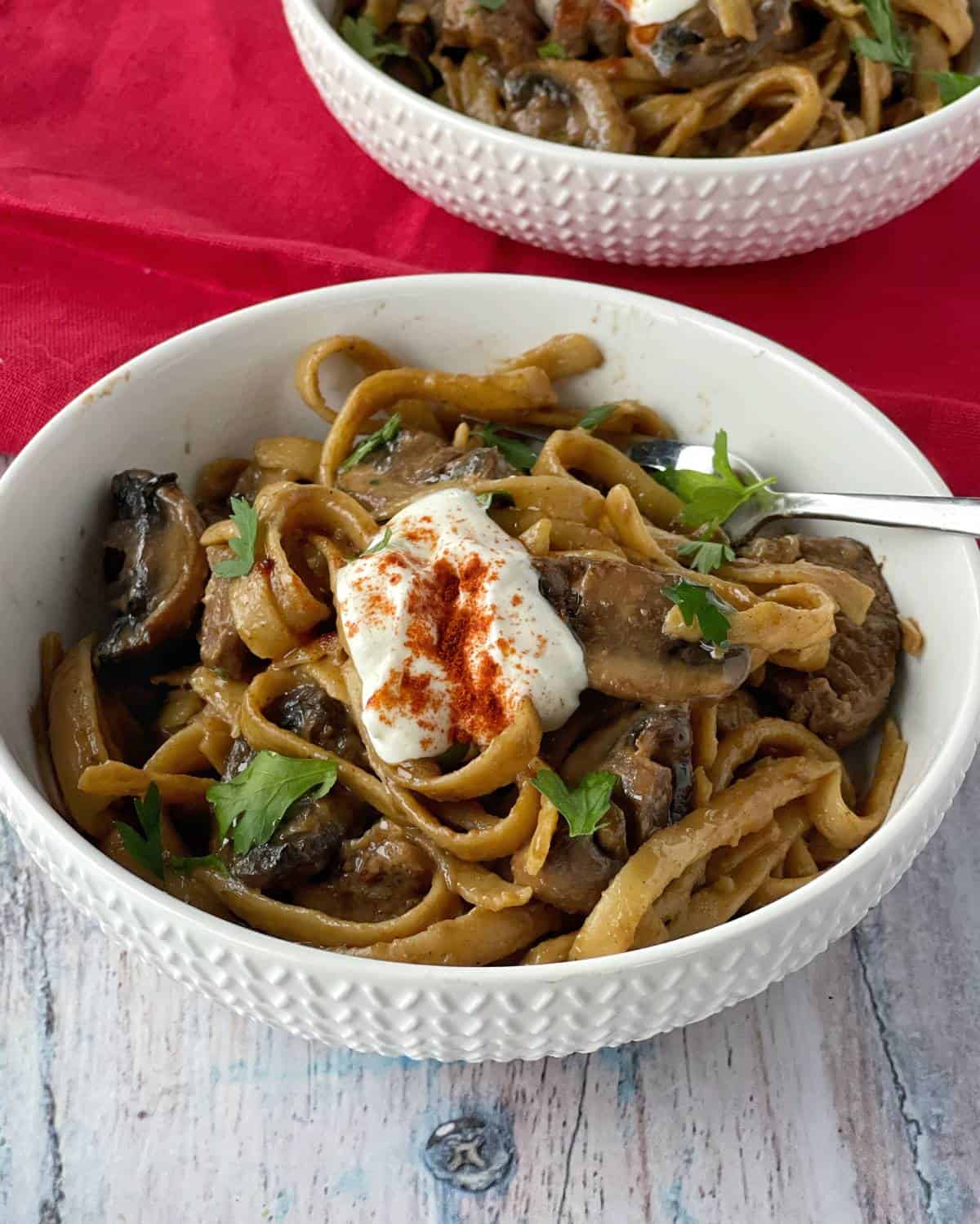 Beef stroganoff served in a white bowl