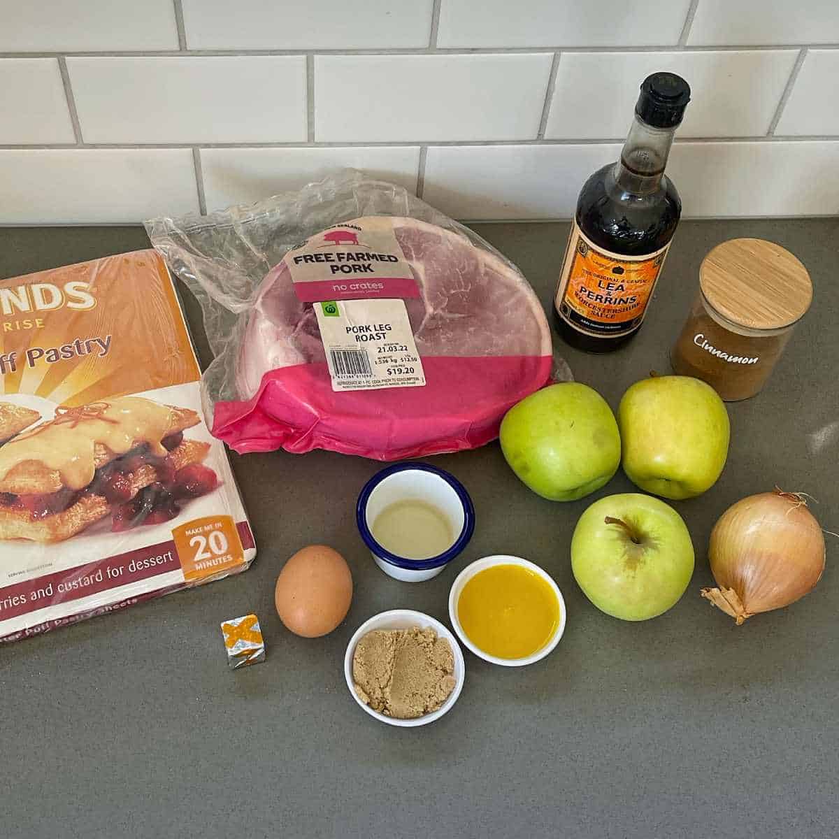 Ingredients for pulled pork and apple pie sitting on a grey bench top