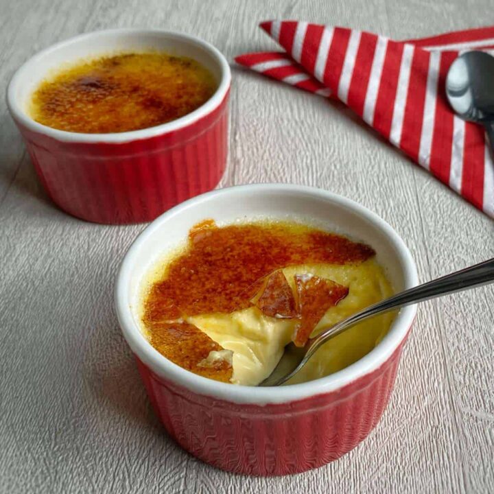 Creme Brulee set with a spoonful being spooned out