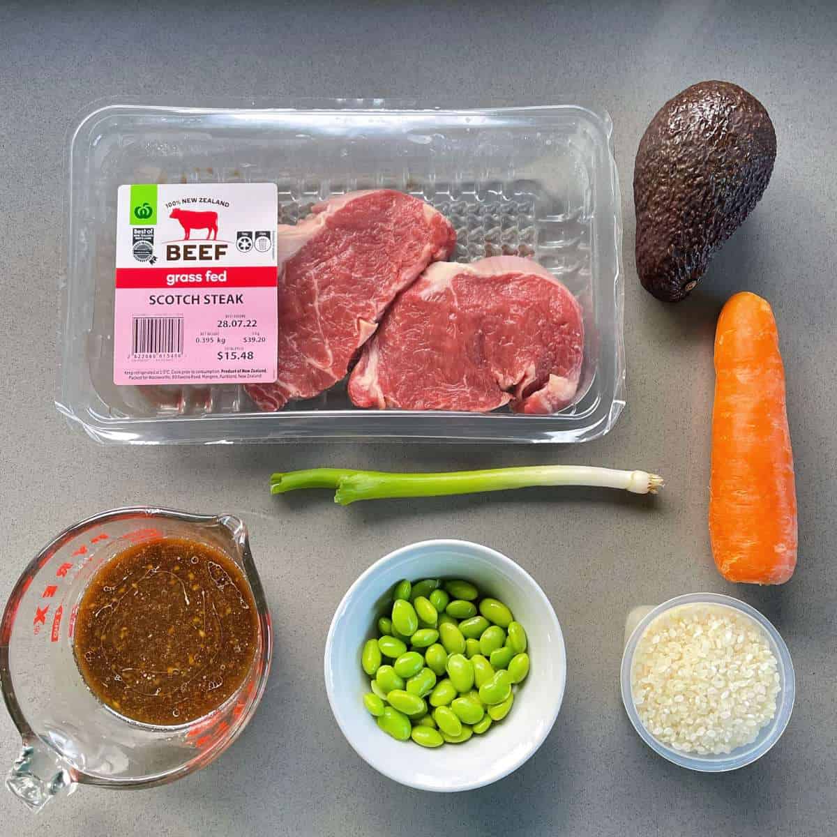 The ingredients for Teriyaki steak Bowls on a grey bench