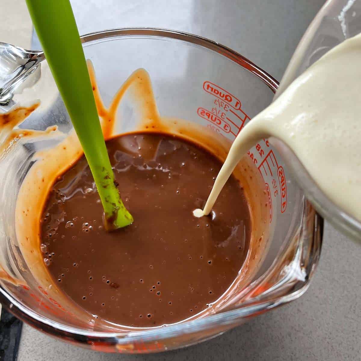 Cream being added into the chocolate cream mixture