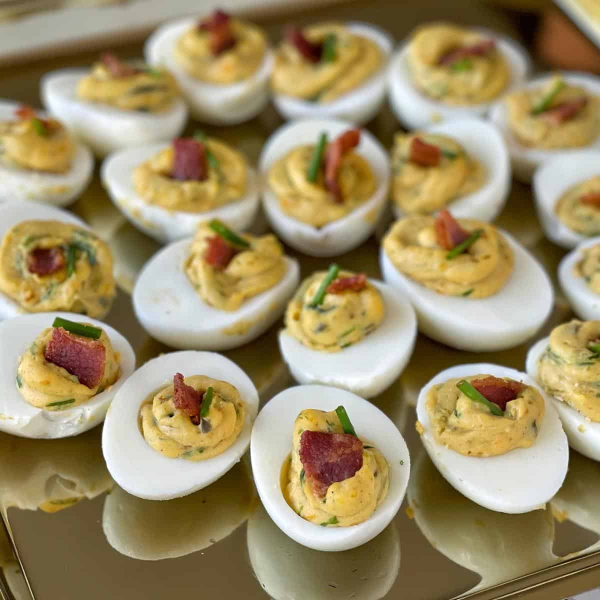 Assembled curried eggs on a gold platter