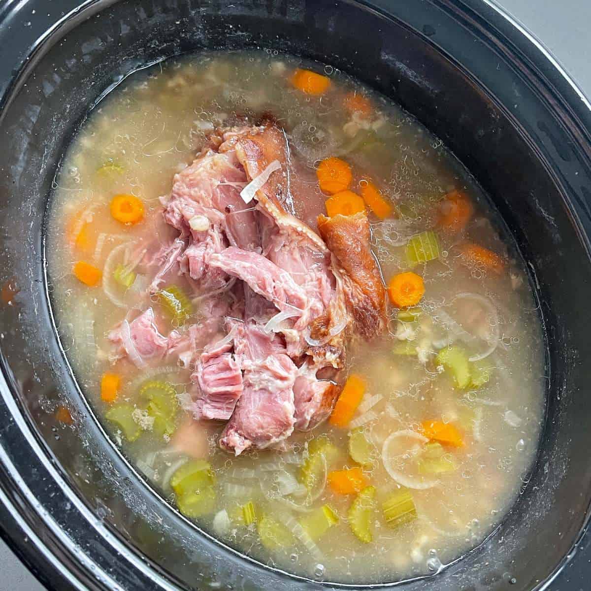 Bacon Hock and Barley Soup cooking in a slow cooker.