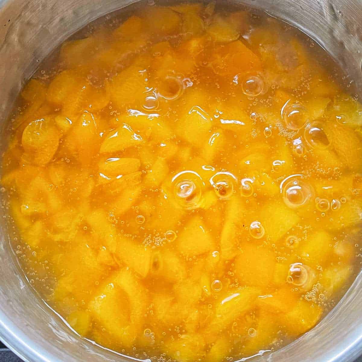 The diced apricots in a small saucepan.