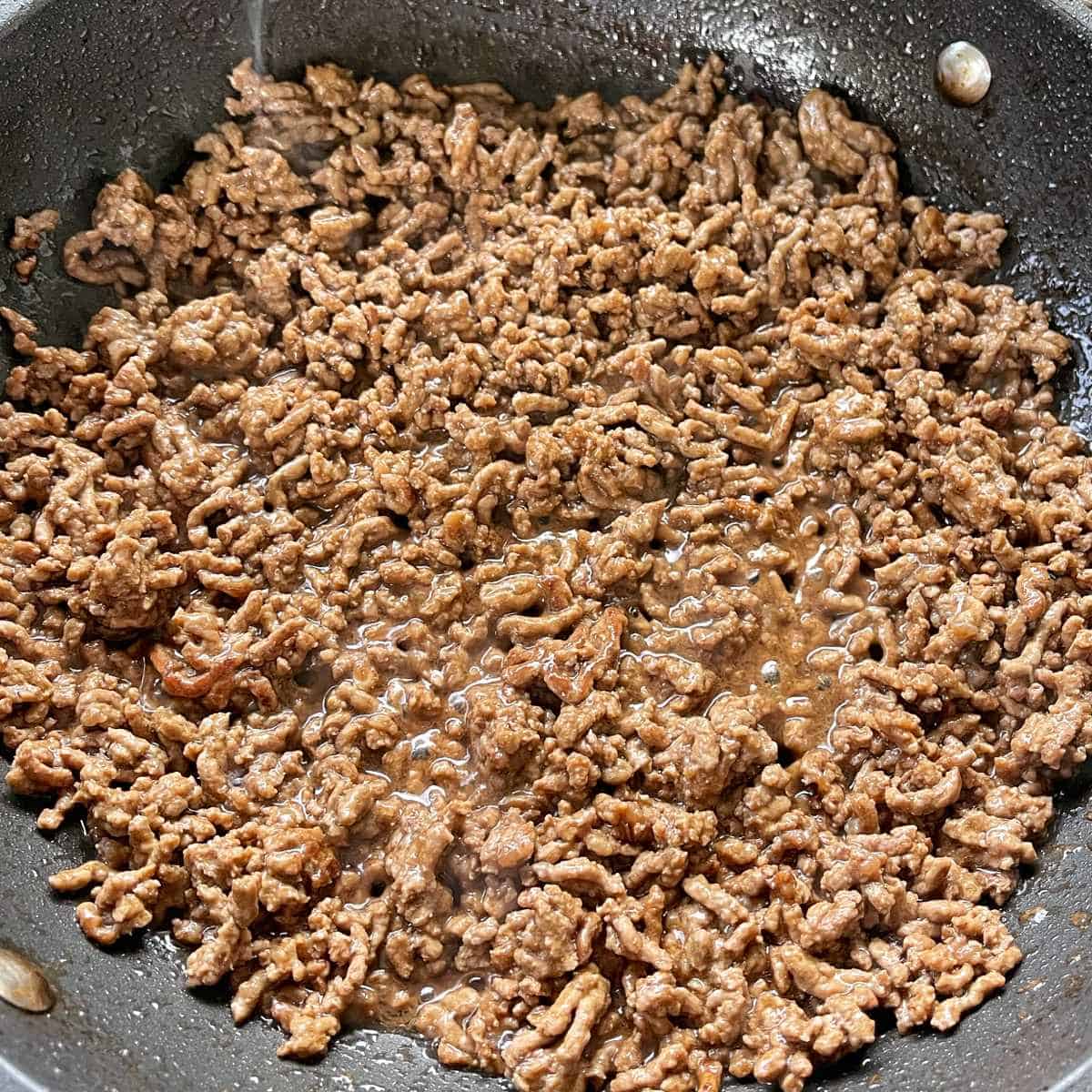Mince for Big Mac Pizzas frying in a frypan.