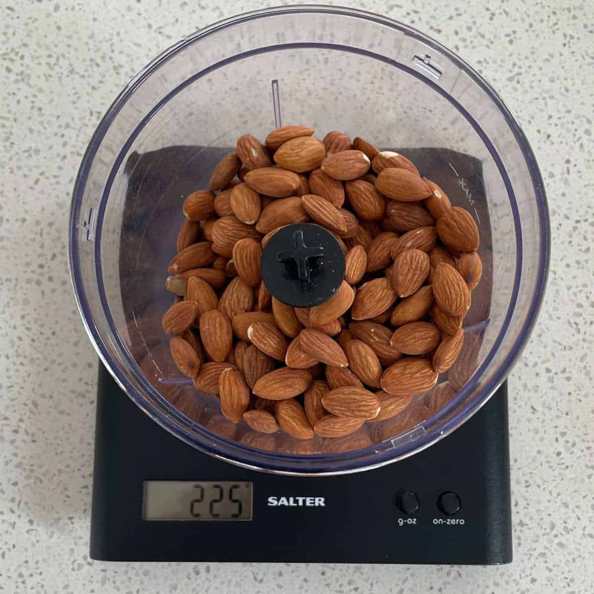 A measurement of almonds being measured out on scales.