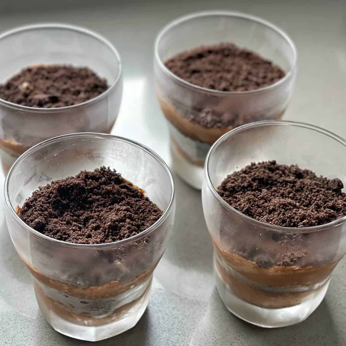 Four Coffee Chocolate Parfaits assembled about to be put in the fridge to set.