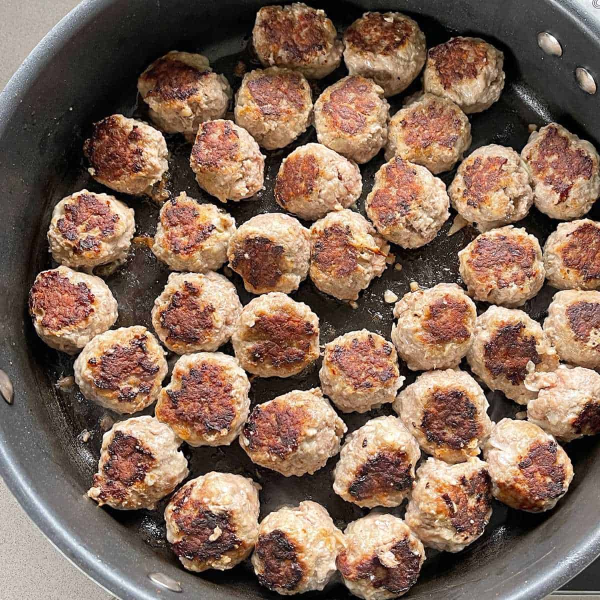 Cooked meatballs in a fry pan