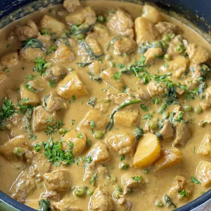 Chicken and Potato Curry gently frying in a frypan.