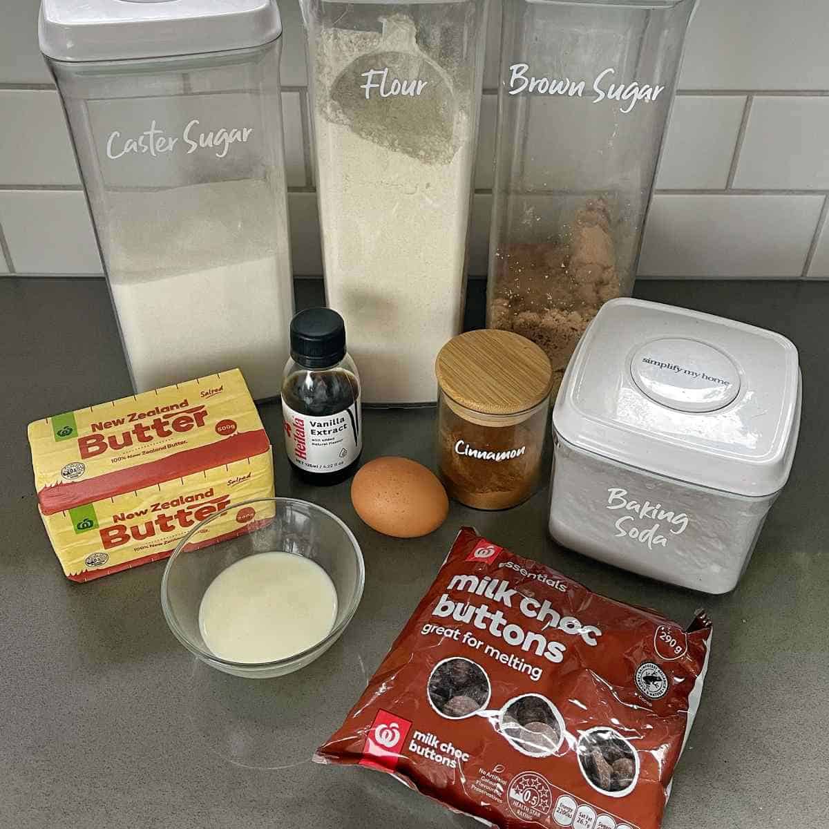 The ingredients for Chocolate Chip Skillet Cookie on a grey bench top.