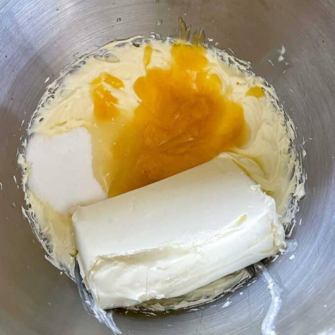 The ingredients for the no bake lemon curd filling in a mixing bowl before it has been combined together.