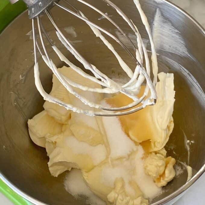 Cream cheese, vanilla essence and sugar in a mixing bowl.