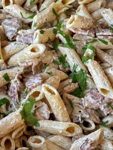 A close up shot of the cooked Creamy Bacon and Mushroom Penne pasta.