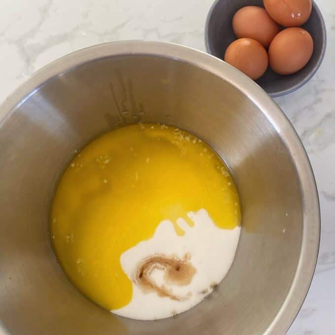 Melted butter in a bowl with sugar.