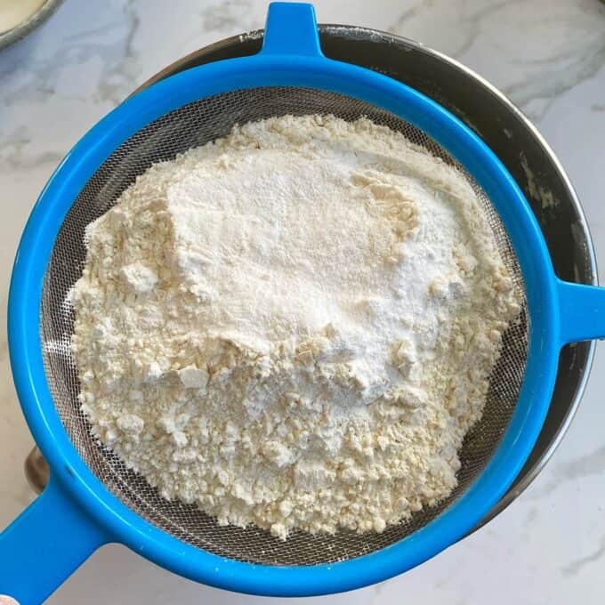 The dry ingredients being sifted into the wet ingredients for Tan Slice