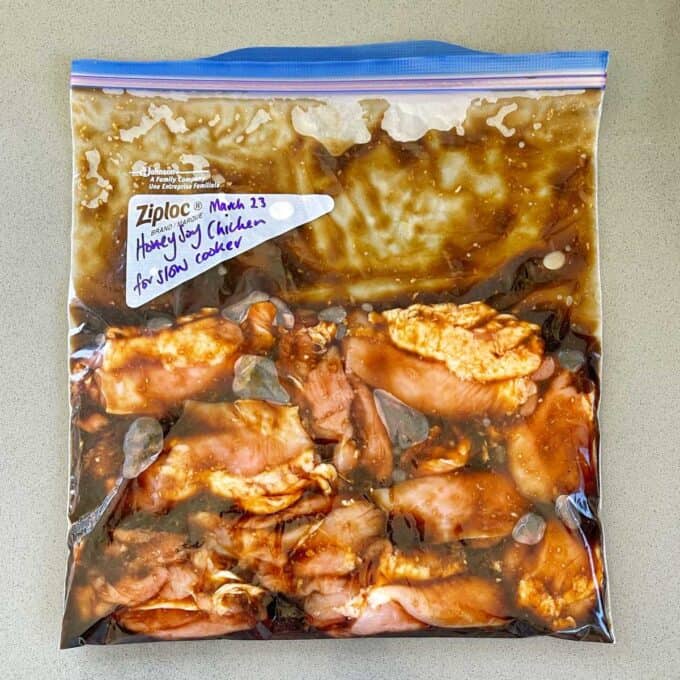 A zip lock bag containing marinated chicken.