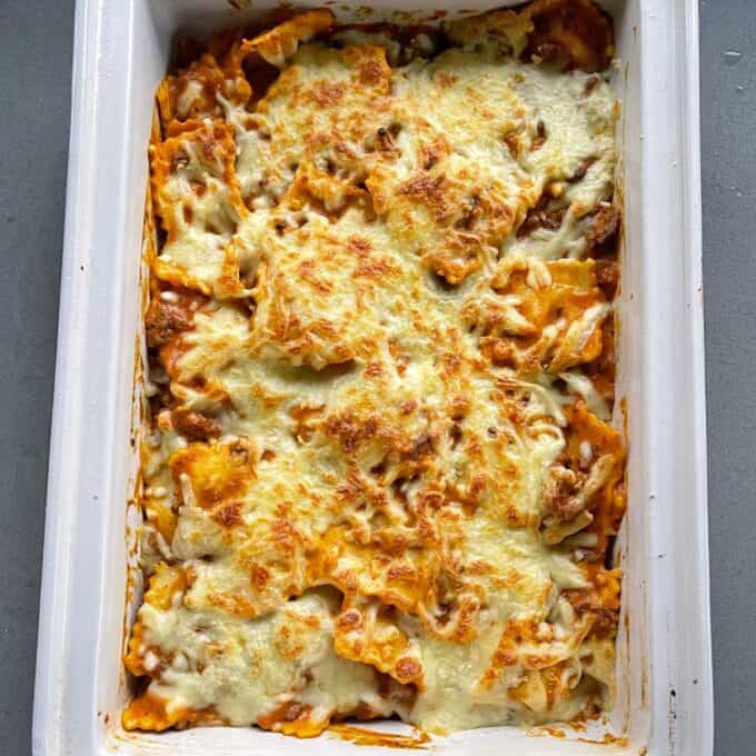 Baked Mince Tortelini in an oven dish on a grey bench top.