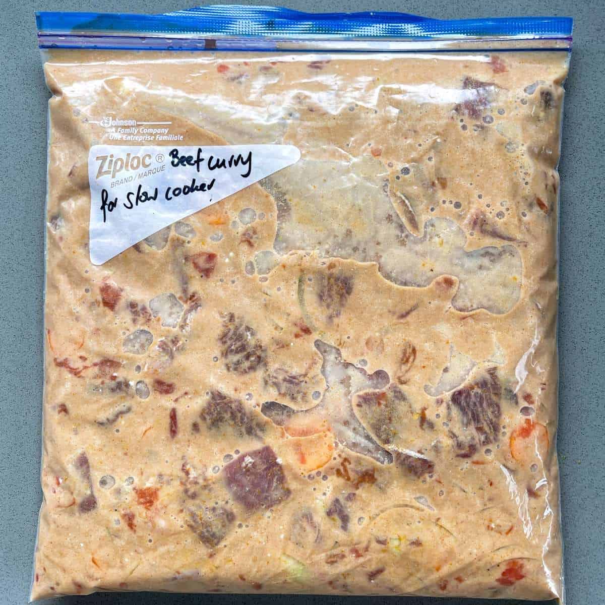 A zip lock bag filled with beef curry mixture so it can be freezed and used at a later date.