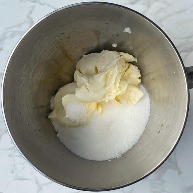 Butter, sugar and cream cheese in a cake mixing bowl
