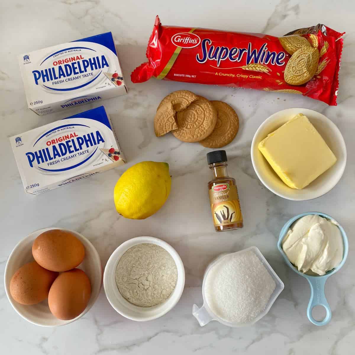 The ingredients for New York Cheesecake on a marble bench top