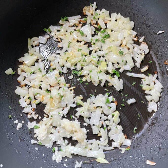 Sautéd onions, garlic and thyme leaves in a meduim frypan.