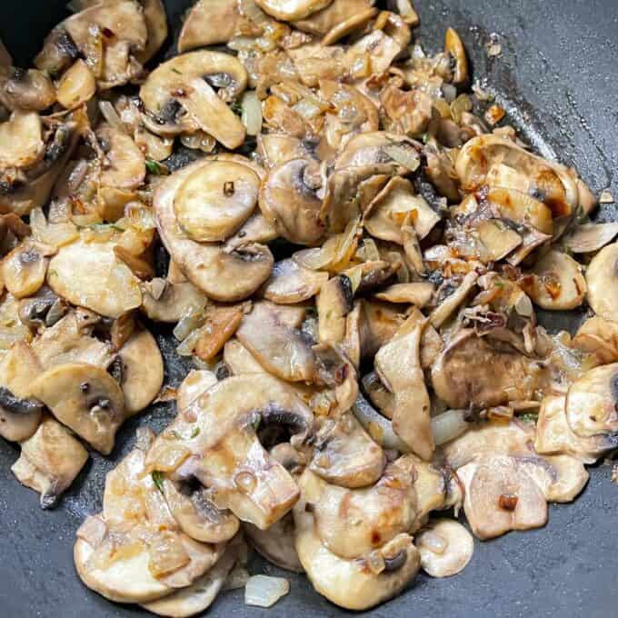 Sautéd onions, garlic, thyme leaves and mushrooms in a meduim frypan.