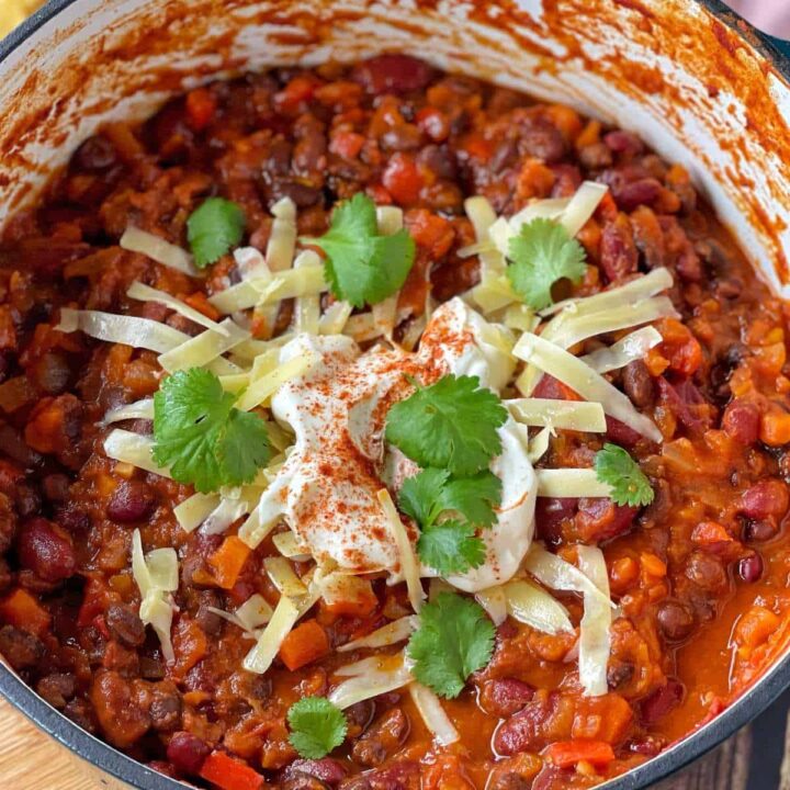 Vegetarian Chilli with a dash of sourcream, and grated cheese on top as well as some coriander leaves.