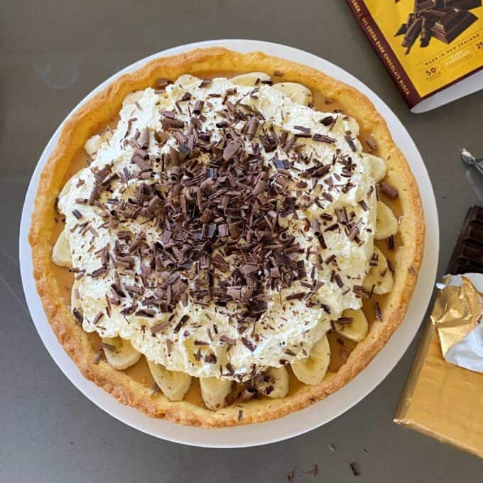 A birdseye view of Banoffee Pie sitting on a grey bench top