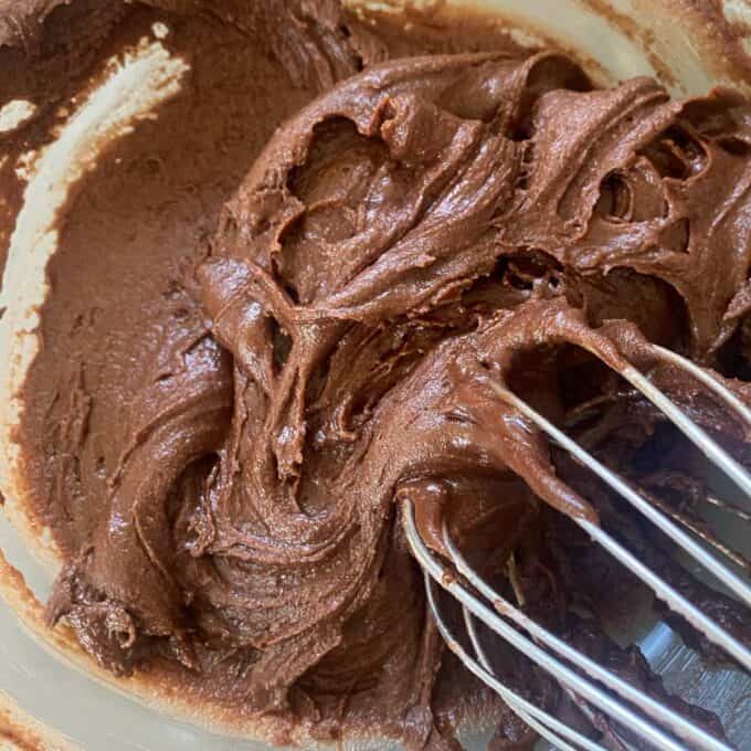 Chocolate icing mixture in a glass bowl