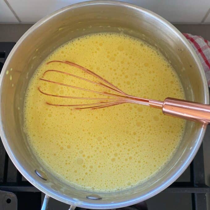 Custard cooking in a small pot