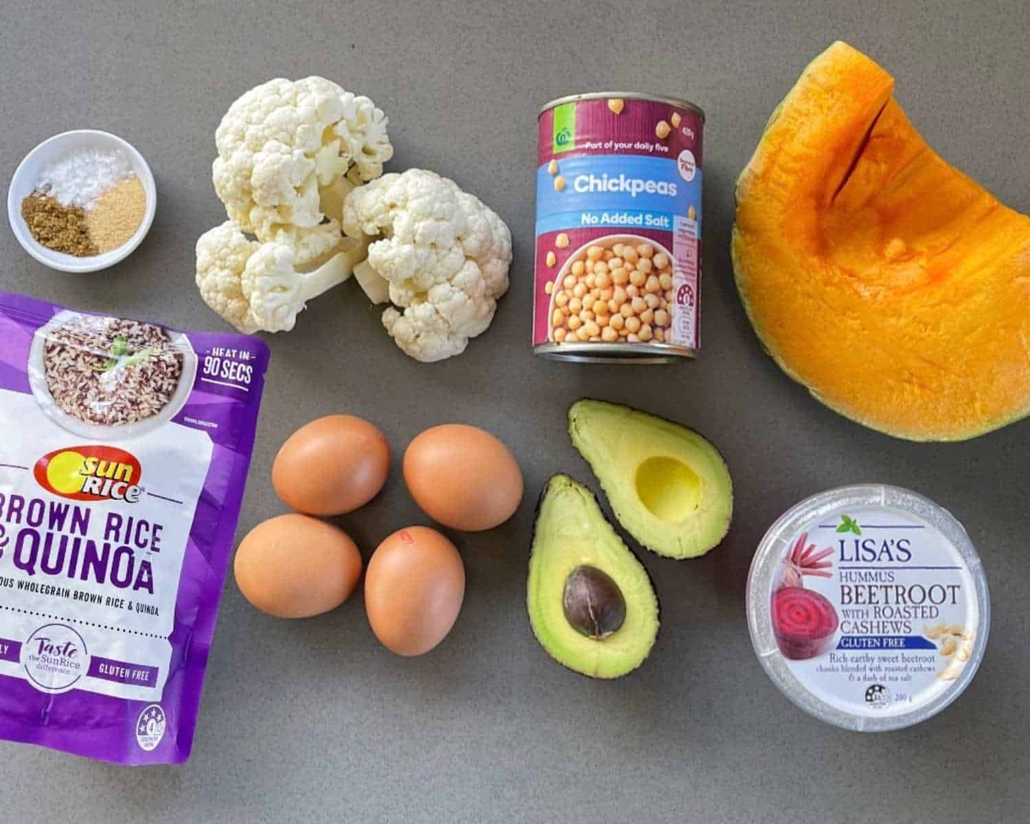 The ingredients to make Nourish Bowls on a grey bench top